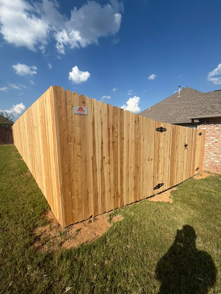 Wood privacy fence with double gate built by Integrity Fence & Outdoor
